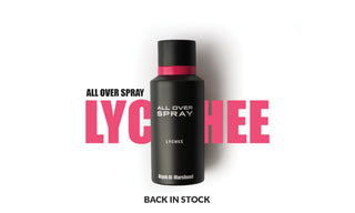Black and pink bottle of Atyab Al Marshoud All Over Spray Lychee with bold text 'LYCHEE' in the background and caption 'Back in Stock' on a white background.