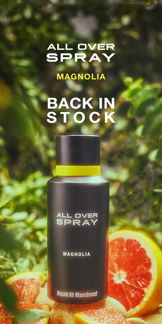 All Over Spray Magnolia bottle with magnolia leaves and oranges in the background