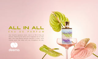 A perfume bottle labeled 'ALL IN ALL EAU DE PARFUM' stands beside a filled coupe glass on a soft pink background, with green and pink tropical leaves arranged around it. The 'deema' brand name and logo appear on the left, with descriptive text about the fragrance.