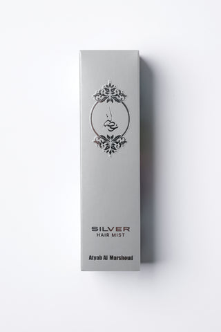Silver hair mist packaging on a white background by Atyab Al Marshoud.