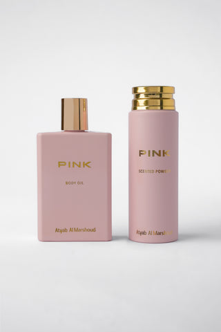 Two pink bottles with gold caps labeled 'Pink' on a white background